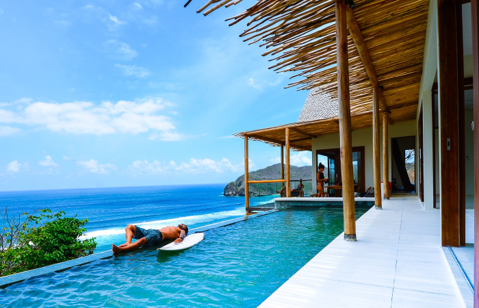 Welcome to the luxurious, all-inclusive Kini Villa, where awe-inspiring beauty and opulence converge to create the ultimate sanctuary for your family vacation. Awaken each morning to breathtaking 180-degree views, as the vibrant landscape unfolds at the foot of your bed, beckoning you to embrace the day. As the sun journeys across the sky, immerse yourself in the mesmerizing panorama from the edge of your private infinity pool…